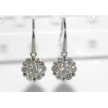 18ct white gold & diamond daisy form earrings 7 diamonds in each cluster, TDW= 1.00ct, weight: