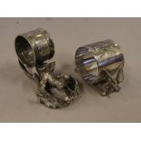 Two figural EP napkin rings