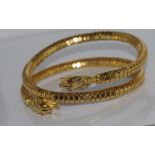 Vintage fashion snake bracelet with red eyes worn higher on arm