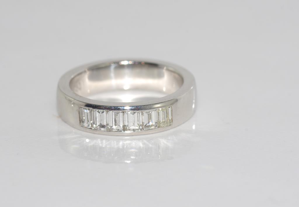 18ct white gold and 6 diamond ring comprising six baguette cut diamonds, TDW = 0.9ct H/Si1,