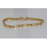 18ct yellow gold and diamond bracelet weight: approx 16 grams, size: approx 19cm