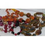 Long pottery bead necklace together with three other vintage necklaces