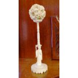 Large antique Chinese carved ivory puzzle ball decorated with floral ball and figural base, 21cm