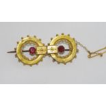 18ct yellow gold and purple-red stone brooch weight: approx 5.4 grams (tests suggest garnet)