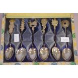 Six Chinese silver spoons with assorted Chinese motif handles, 52 grams approx