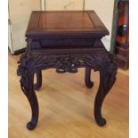 Vintage Chinese square occasional table with carved butterfly corners to top above ornately carved
