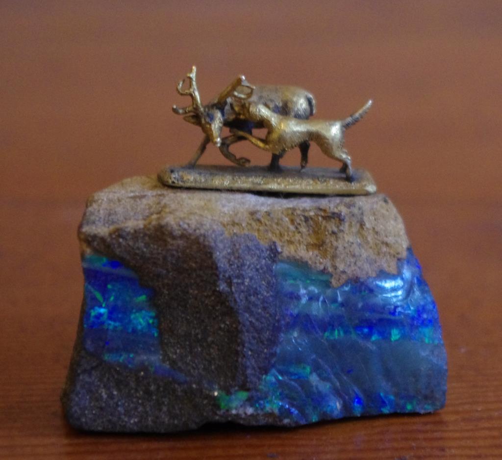 Small opal rock with mounted stag sculpture 4cm high