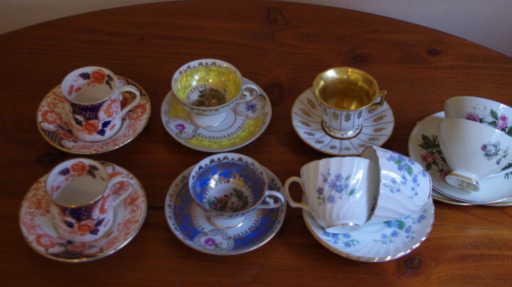 Nine various coffee cups with saucers including Crown Staffordshire