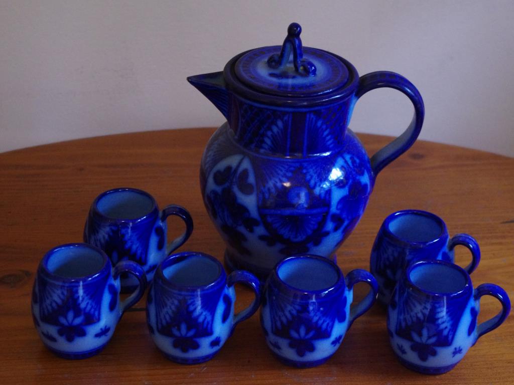 Portuguese pottery coffee set comprising coffee pot and six cups.