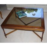 Large square coffee table with glass top