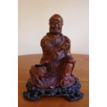 Chinese carved timber Buddha on stand 22cm high