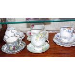 Four porcelain trios together with 2 cups and saucers