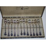Boxed set of 12 plated coffee spoons each with floral handle.