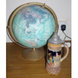Globe of the world together with a large German beers stein