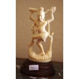 Antique carved ivory figure of Indian God on a timber stand, 11.5cm high (figure only). NB Export