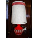 Retro red pottery table lamp with original shade, 51cm high approx.