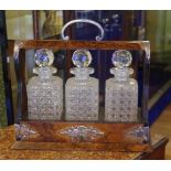 Antique walnut 3 decanter tantalus with 3 cut glass decanters, 37cm wide, 33cm high approx