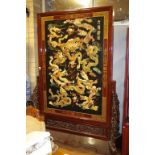 Large Chinese decorative lacquer ware screen with applied carved dragon decoration, H220cm X