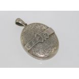Vintage large locket with leaf and buckle design on front and plain on rear, size: 6 by 4 cm
