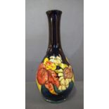 Moorcroft blue orchid pattern vase marks and signature to base, 26cm high approx