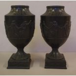 Pair of engine turned Wedgwood black basalt urns impressed Wedgwood 19th century mark to base, 20.