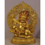 Large Tibetan Yama gilt bronze metal statue (The lord of death), Yama in a powerful stance on top of