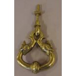 Large brass door knocker decorated with fish heads
