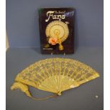 Antique MOP & lace fan together with a book on fans