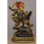 Tibetan gilt bronzed figure of Yama & Chamunda (god of death),Yama striding on a buffalo over a