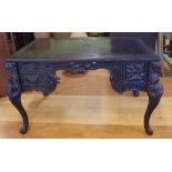Ornately carved vintage Chinese lacquered desk with 2 drawers and a single door compartment to