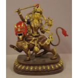 Tibetan gilt bronze figure of Tara (known as mother of liberation), riding on a mythical beast,