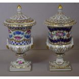 Two Dresden floral and gilt lidded miniature urns H16cm approx