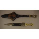 Two decorative weapons comprising of a dagger knife 44cm long and a tribal club