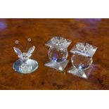 Pair of Swarovski crystal candlesticks together with a cut crystal miniature bee on a mirror