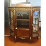French walnut and ormolu display cabinet with curved glass door mirror back compartments to each