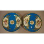 Pair of 18th century Sevres saucers in celeste blue, hand painted with cherubs, heightened with