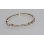 Silver hinged bracelet set with CZ