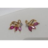 Delicate 9ct gold, ruby and diamond studs weight: approx 1.38 grams