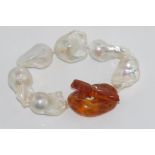 Baroque pearl bracelet with an amber toggle clasp