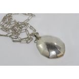 Silver necklace with large rattle pendant