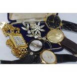 Five various fashion watches including watch marked "Gucci" together with a vintage brooch