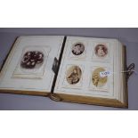 Antique 'White Flower' photograph album partially filled with mostly portrait photos, 29.5cm x 23cm