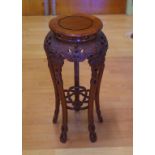 Chinese rosewood plant stand with ornate carving, 31cm diameter, 64.5cm high