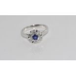 18ct gold Ceylon sapphire & diamond daisy ring set in white gold and comprising 6 diamonds = 0.76cts