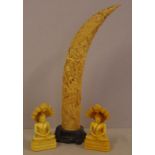 Chinese dragon tusk on timber stand together with 2 Tibetan seated Buddha figurines, H39cm approx (