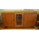 Art Deco Standis Furniture sideboard with 2 outer doors opening to shelves and drawers, a centre