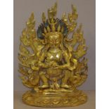 Tibetan gilt bronze figure of Yama (god of death),Yama striding over a prostrate body, H49cm approx