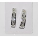 18ct white gold diamond earrings total 14 channel set diamonds = 1.00cts - H /Si 1, weight: approx