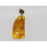 Large natural Baltic amber pendant with garnet and gilt fittings
