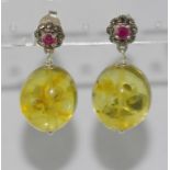 Amber earrings with silver and ruby fittings
